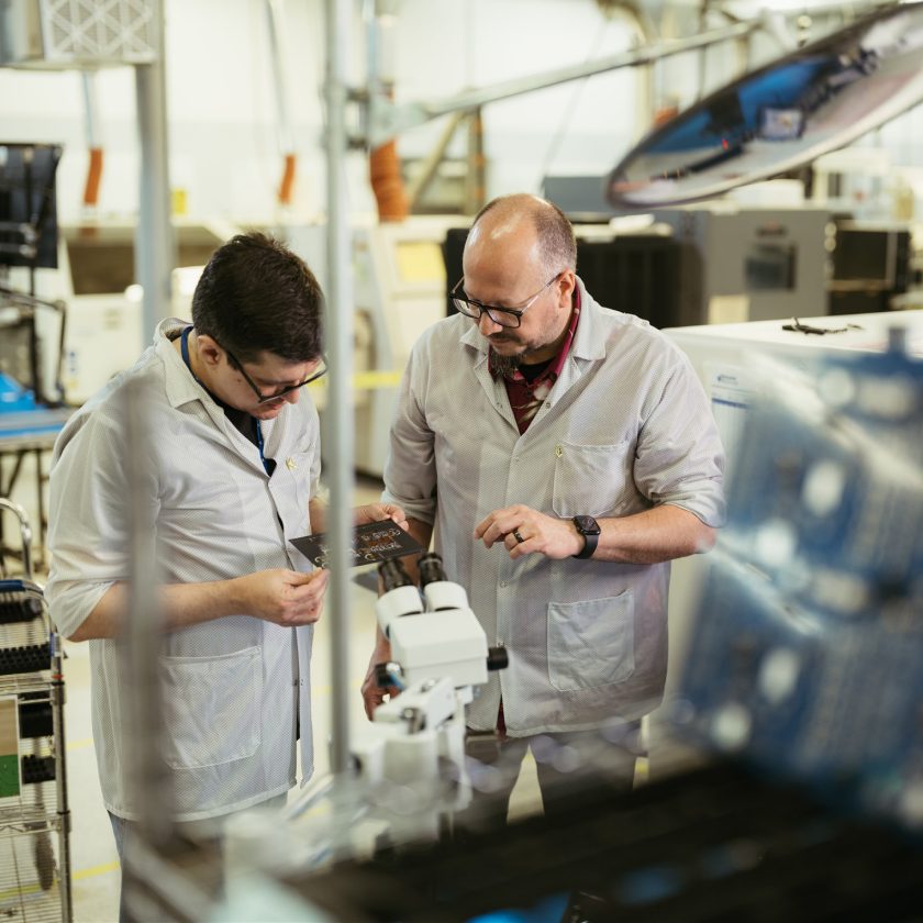 Milwaukee Electronics team members working together on the production floor